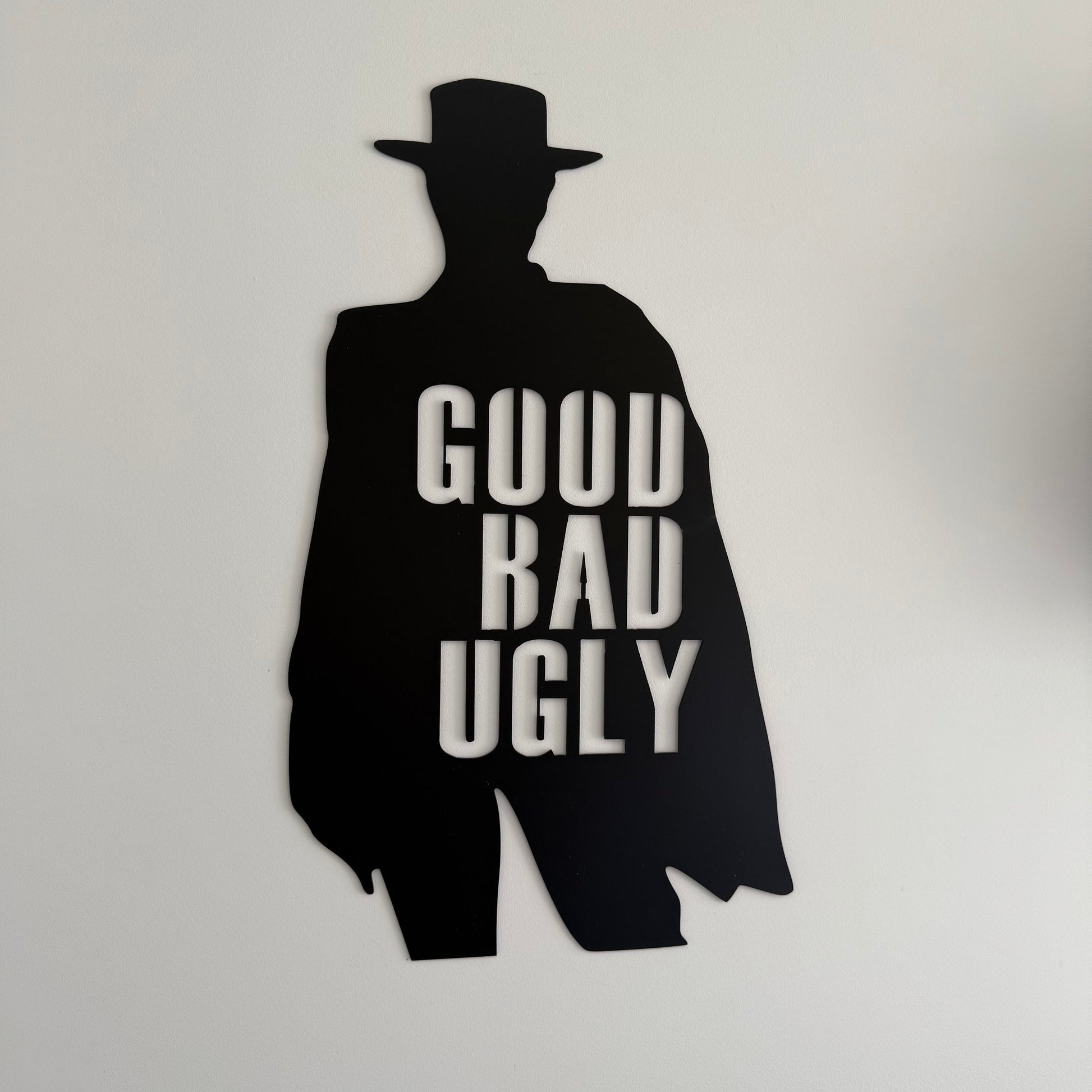 Black silhouette of Clint Eastwood with 'Good Bad Ugly' text on a white background